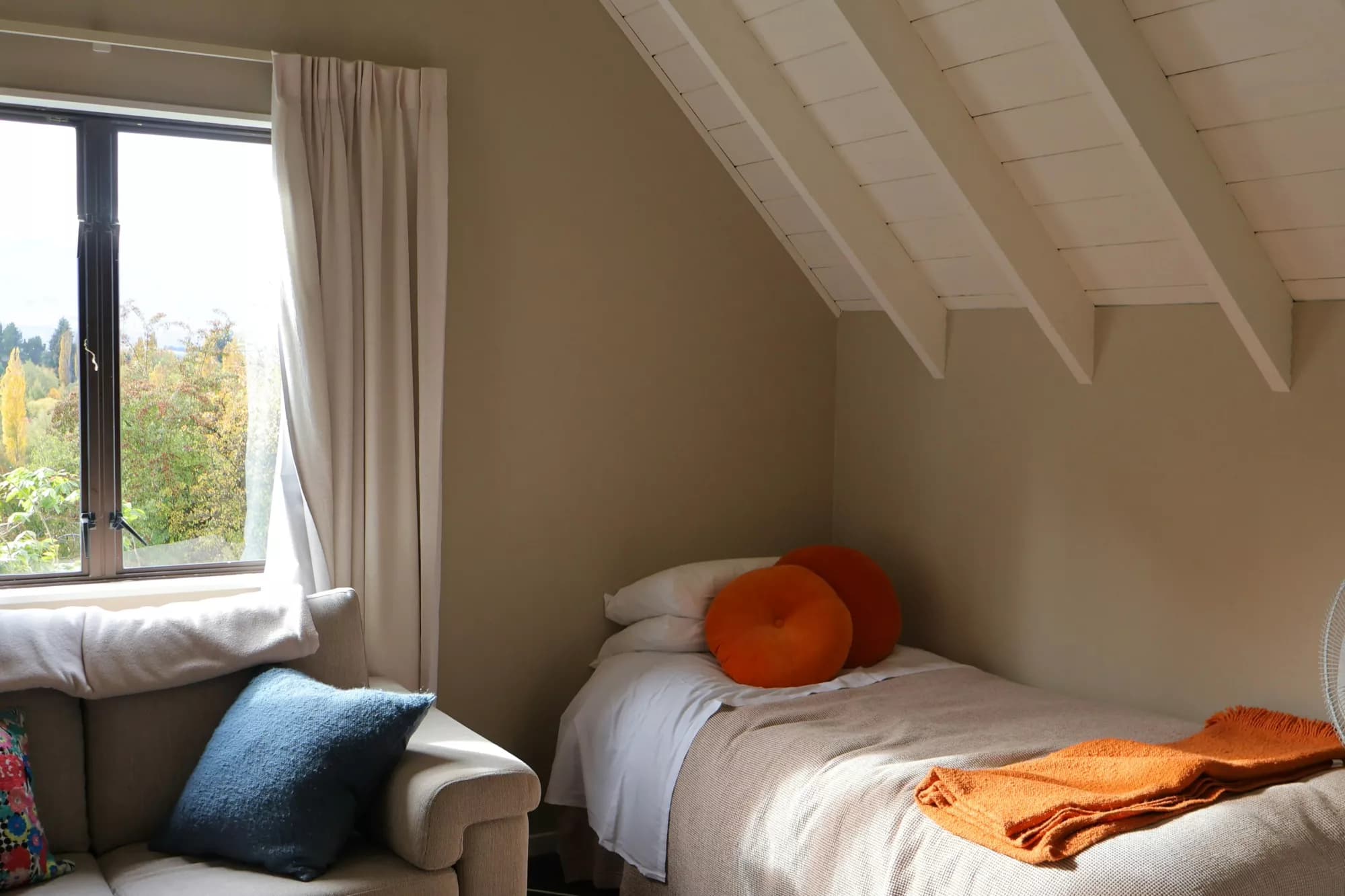 A small bedroom with a single bed and little walking space